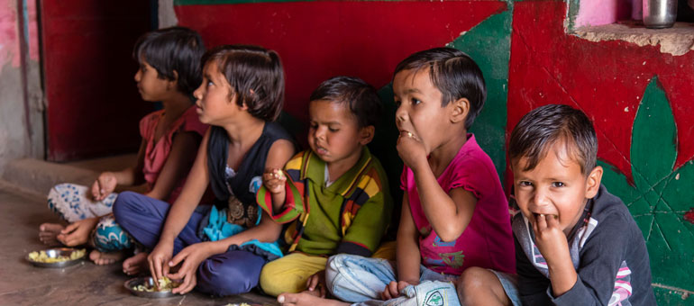 Children eating in India