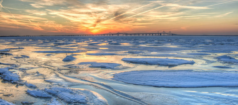 Frozen bay at sunrise