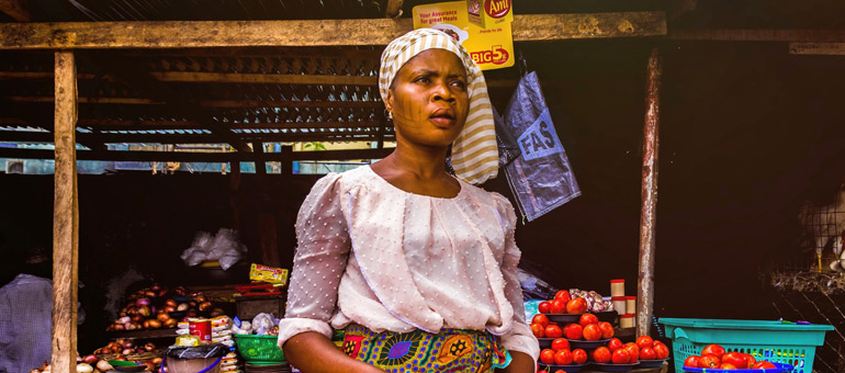 Woman selling tomatoes africa