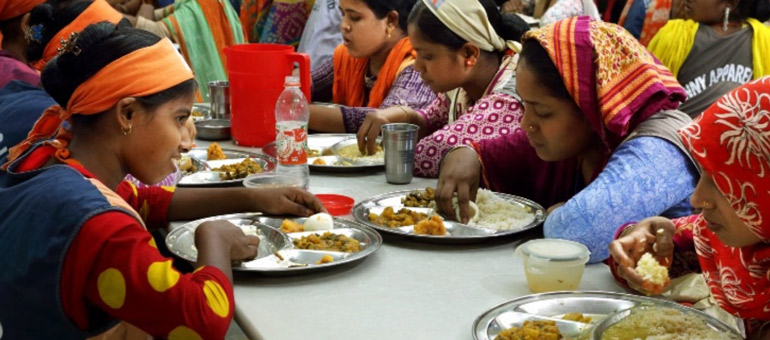 Women wearing colorful clothes eating together Bangladesh