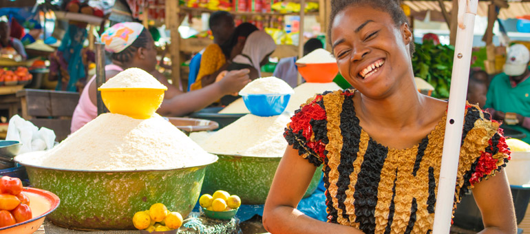 Young African Girl smiling in a market in Africa