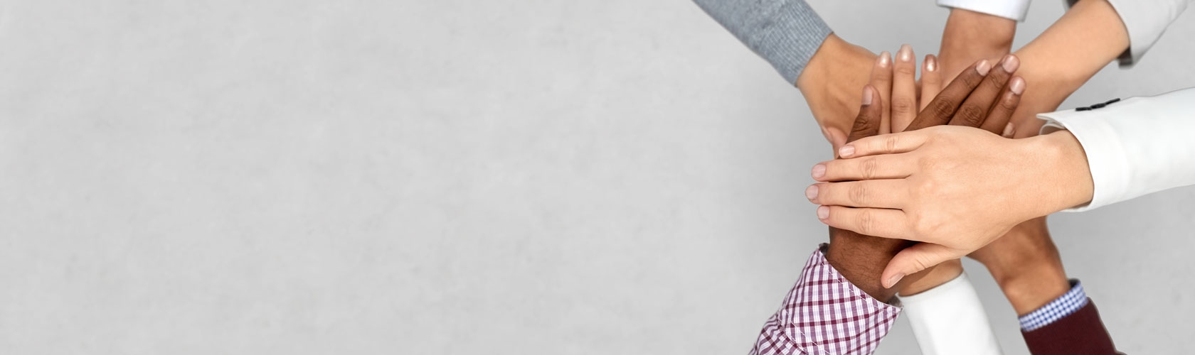 Adult hands crossed together