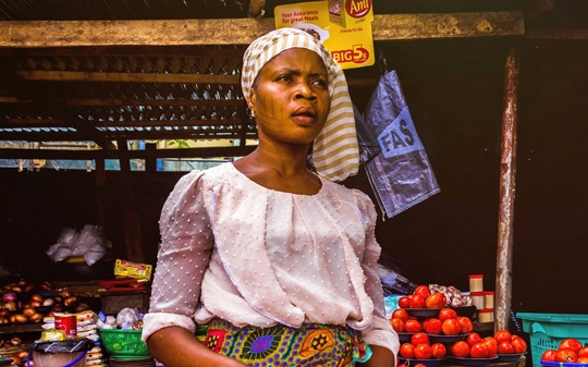 Woman selling tomatoes in Africa
