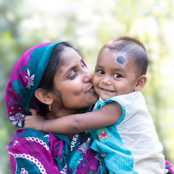Bangladesh cover image - woman kissing baby
